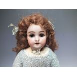 A VINTAGE BISQUE HEADED DOLL MARKED DEP 9, jointed composition body, blue glass sleeping eyes,