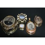 A COLLECTION OF MOURNING BROOCHES ETC, to include a swivel two sided picture brooch pendant, largest