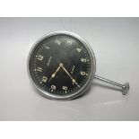 A VINTAGE JAEGER 8 DAY AUTOMOBILE DASHBOARD CLOCK, the black dial having Arabic numerals and