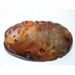 A 20TH CENTURY CHINESE CARVED AGATE TOUCHSTONE, W 5 cm, L 9 cm