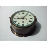 SMITHS 'ASTRAL' BRASS CASED BULKHEAD CLOCK, the circular dial with Roman numerals, Dia. 17.5 cm