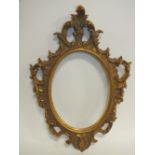 A 20TH CENTURY CARVED WOODEN FLORENTINE STYLE GILT FRAME, rebate 24 x 18 cm, frame W 6 cm