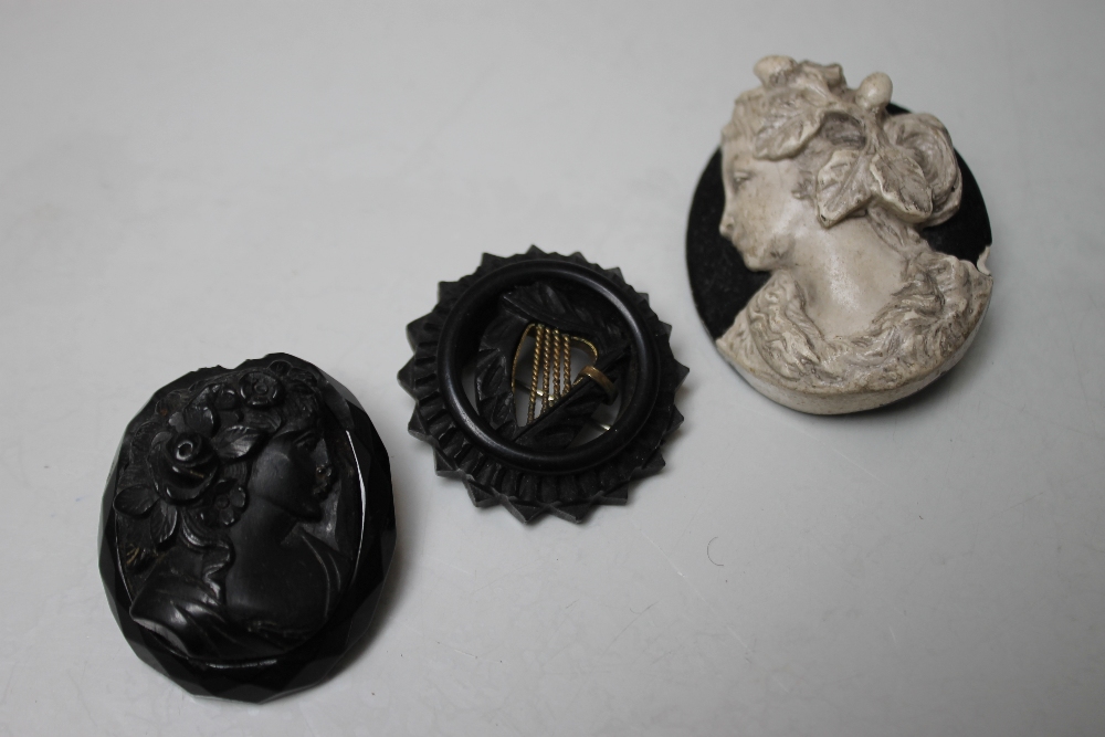 A COLLECTION OF VINTAGE BROOCHES AND COLLAR STUDS, to include a caved bog oak brooch with central - Image 2 of 2