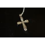 A HALLMARKED 9 CARAT WHITE GOLD DIAMOND SET CROSS, approx weight 4.7g, H 4 cm