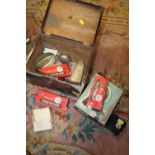 A VINTAGE BOX CONTAINING A SMALL QUANTITY OF CAMERA EQUIPMENT