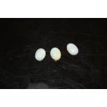 THREE LOOSE OVAL OPAL TYPE STONES