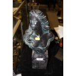 A BRONZE EFFECT BUST OF A LADY ON MARBLE TYPE PLINTH