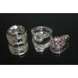 THREE PIECES OF 925 SILVER JEWELLERY, consisting of a solitaire style ring, pierced band ring set