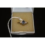 AN 18CT WHITE GOLD SAPPHIRE AND DIAMOND RING, in a rub over setting, approx weight 4.2g, ring size N