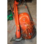 A FLYMO HOVER VAC PLUS A FLYMO STRIMMER