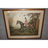 A FRAMED AND GLAZED SIGNED RICHARD SMYTHE PRINT OF A HUNTSMAN ON HORSEBACK