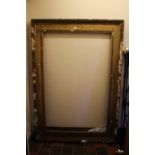 A LARGE GILT PICTURE FRAME A/F