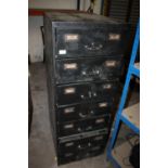 A SEVEN DRAWER METAL FILING CABINET