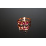 A HALLMARKED 9 CARAT ROSE GOLD RING, set with four pink stones, approx weight 2.4g, ring size N 1/2