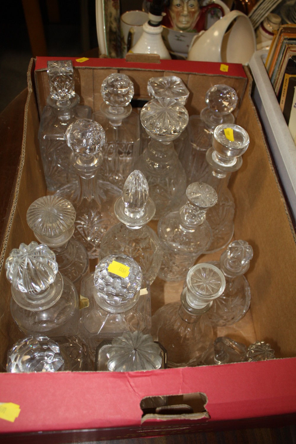 A LARGE QUANTITY OF CUT GLASS DECANTERS