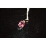 A HALLMARKED 18 CARAT WHITE GOLD PENDANT, the oval cut pink stone being an estimated 3 carats