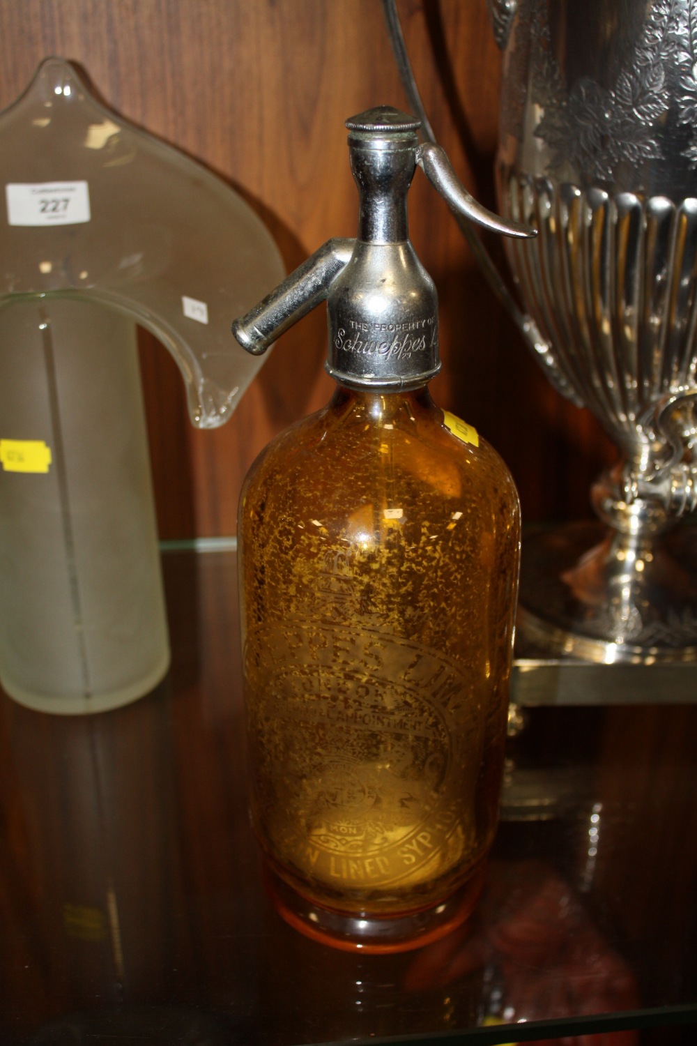 A SCHWEPPES AMBER GLASS SODA SYPHON