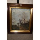 AN OAK FRAMED OIL ON CANVAS DEPICTING A COUNTRY LANE