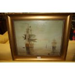 AN UNSIGNED GILT FRAMED OIL ON CANVAS DEPICTING SHIPS AT SEA