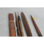 A GROUP OF OCEANIC TYPE PAINTED WOOD IMPLEMENTS, to include a fishing spear