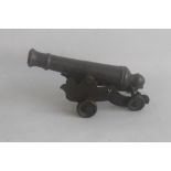 A BRONZE SIGNAL CANNON OF EARLY 18TH CENTURY TYPE, mounted on sheet brass carriage overall length of