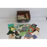 A COLLECTION OF BOY SCOUTS AND GIRL GUIDES RELATED ITEMS, to include badges, pennants, books,