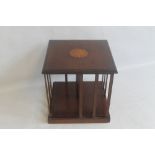 AN EDWARDIAN MAHOGANY REVOLVING TABLE TOP BOOK STAND, with inlaid decoration