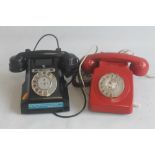 A VINTAGE BLACK BAKELITE TELEPHONE 1960S MODEL 312L, together with a red plastic telephone 1970s 700