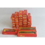 A COLLECTION OF TRIANG RAILWAYS "00"GAUGE CARRIAGES AND ROLLING STOCK, red/yellow (30)