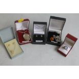 A QUANTITY OF SILVER JEWELLERY, to include a silver locket on chain, an amber type pendant etc