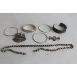 A QUANTITY OF SILVER BANGLES AND BRACELETS and a silver rope