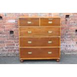 A 19TH CENTURY HARDWOOD CAMPAIGN CHEST, typically split in two parts, having inset brass handles,