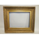 A 19TH CENTURY GOLD FRAME, with acanthus leaf top edge and decorated scoop with slip, frame W 11 cm,