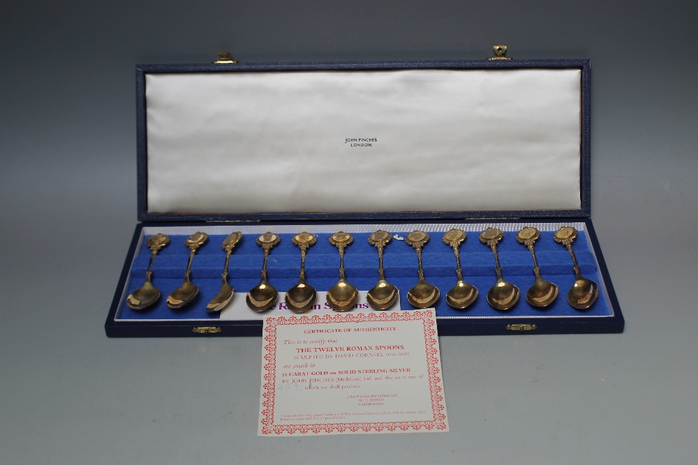 A CASED SET OF TWELVE HALLMARKED SILVER GILT 'ROMAN' TEASPOONS BY JOHN PINCHES - LONDON 1971, approx