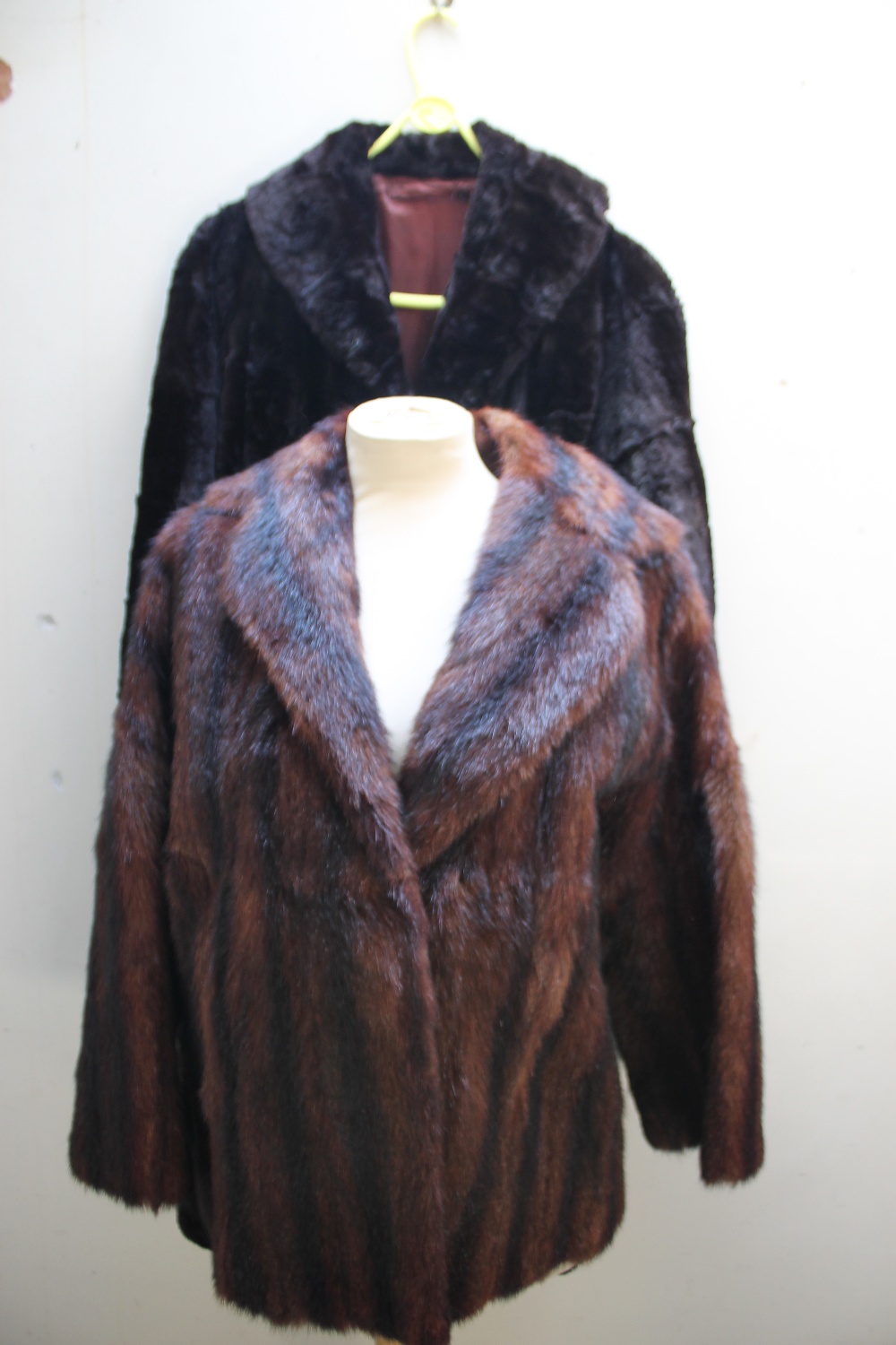 TWO LADIES VINTAGE REAL FUR COATS, comprising a short musquash striped brown jacket and a black