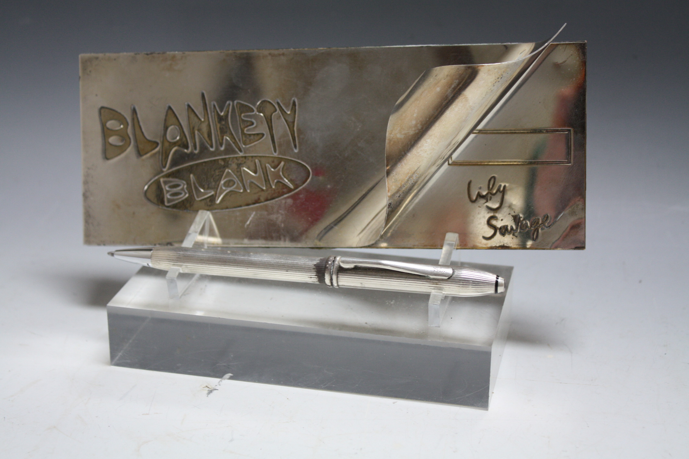 A GENUINE SILVER PLATED BLANKETY BLANK CHEQUE BOOK AND PEN, from the Lily Savage series, the 'Cross'