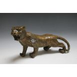 A CHINESE STYLE BRONZE TYPE FIGURE OF A TIGER, W 34.5 cm, A/F