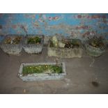 A STONE GARDEN TROUGH TOGETHER WITH 4 PLANTERS