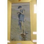 A FRAMED AND GLAZED PRINT OF A GIRL ON THE BEACH