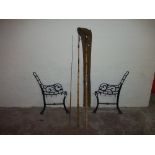 A PAIR OF CAST BENCH ENDS TOGETHER WITH A VINTAGE FISHING ROD