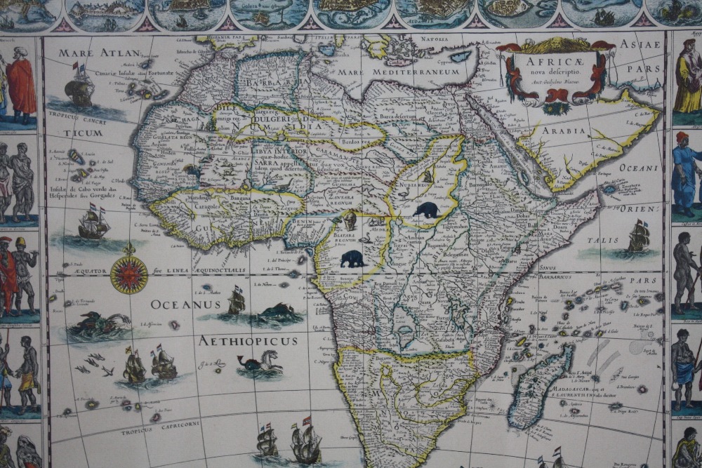 A VINTAGE MAP OF AFRICA, with vignette studies of indigenous inhabitants, 37 x 49 cm