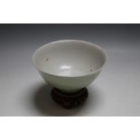 A CHINESE TYPE CELADON BOWL, on hardwood stand, Dia 13 cm