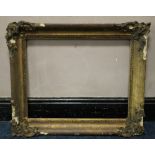 A 19TH CENTURY GOLD FRAME WITH CORNER EMBELLISHMENTS (A/F), frame W 10 cm, rebate 63 x 51 cm