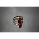 AN 18 CARAT WHITE GOLD FIRE OPAL AND DIAMOND RING, set with a Mexican Fire opal type central stone