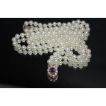 A SET OF CULTURED PEARL WITH HALLMARKED 9 CARAT GOLD AMETHYST AND PEARL CENTRAL DROPPERCondition
