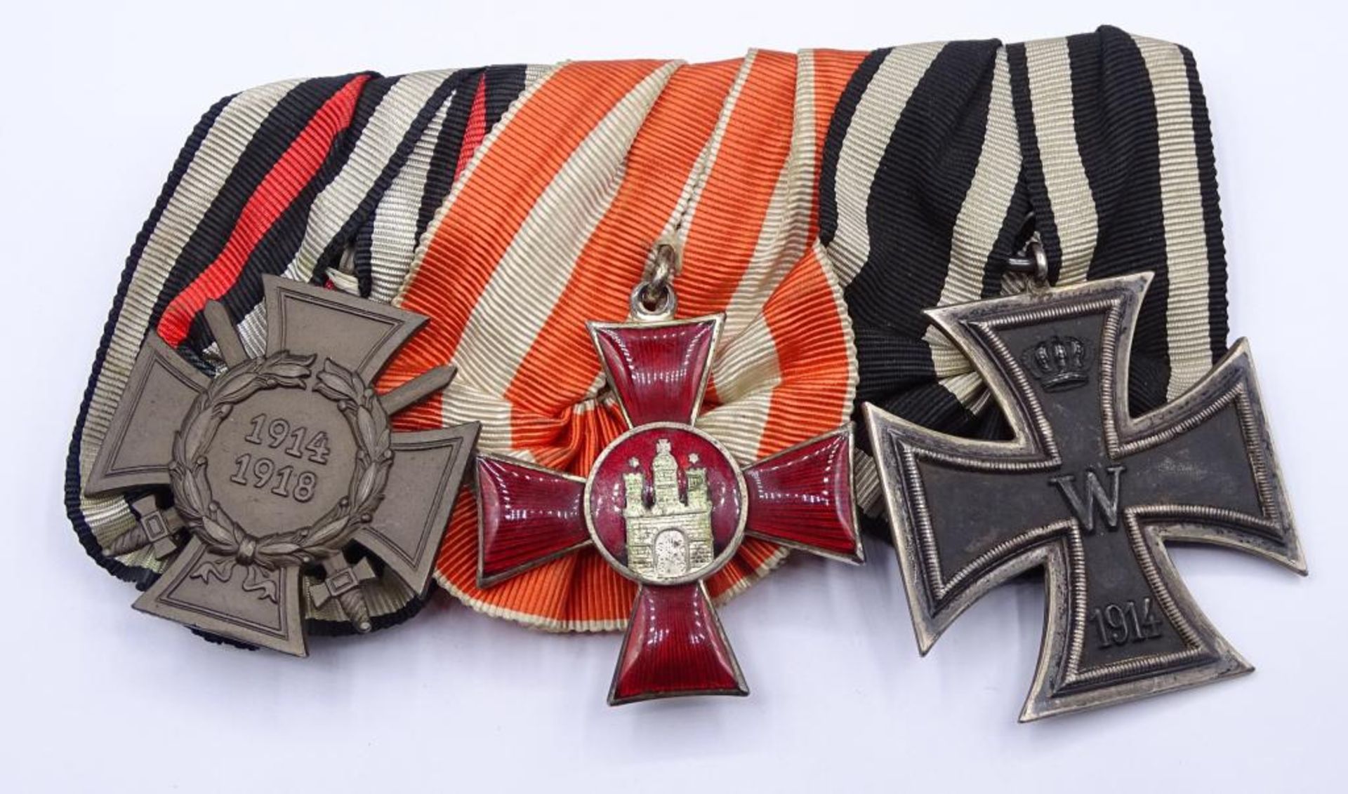 Ordensspange mit 3 Abzeichen,Kriegsteilnehmerkreuz,Eisernes Kreuz 1.Wk,2.Klasse, und Hanseatenkreuz