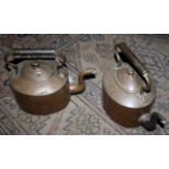 Pair of Victorian copper kettles, large and medium sized