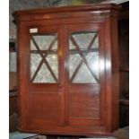 Mahogany corner cupboard, shaped shelves and partially glazed doors