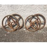 A set of four English cast iron wheels circa 1900.