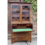 Georgian Secretaire book case, astragal glazed and standing upon its original bracket feet.